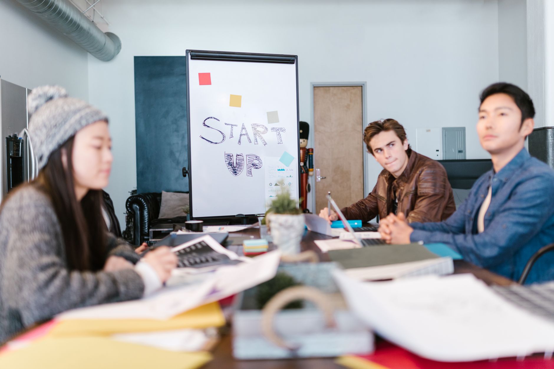 A group of young professionals brainstorming ideas in a startup office setting. (Photo by RDNE Stock project on Pexels)